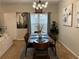 Stylish dining room featuring a modern light fixture and comfortable seating for six at 1281 Rockfield Cir, Norcross, GA 30093