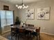 Inviting dining room with modern light fixture and floral artwork, creating an elegant space for meals at 1281 Rockfield Cir, Norcross, GA 30093