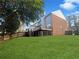 Expansive backyard with a well-maintained lawn, wooden deck, and privacy fence at 1444 Twin Branches Se Cir, Marietta, GA 30067