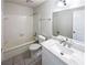 Clean bathroom with a tile backsplash and a well-maintained tub and shower combo at 1444 Twin Branches Se Cir, Marietta, GA 30067