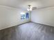 Spacious bedroom with a ceiling fan and a window bringing in natural light at 1444 Twin Branches Se Cir, Marietta, GA 30067