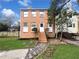 Charming brick home featuring a well-manicured front yard and inviting walkway to the front door at 1444 Twin Branches Se Cir, Marietta, GA 30067