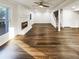 Spacious living room featuring gleaming hardwood floors, a fireplace, and ample natural light at 1444 Twin Branches Se Cir, Marietta, GA 30067