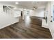 Bright open concept living room with fireplace, hardwood floors, and stairs at 1444 Twin Branches Se Cir, Marietta, GA 30067