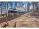 Charming two-story home with a large wooden deck and partially finished walk out basement on a wooded lot at 1780 Williams Cir, Cumming, GA 30041