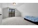 Bright bedroom featuring carpet, a bed, and a sliding door to the outside at 1780 Williams Cir, Cumming, GA 30041