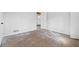 Bedroom featuring unfinished floors, white walls and a view to hallway at 1780 Williams Cir, Cumming, GA 30041