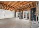 Spacious living room with stone fireplace, exposed wood ceiling and walk-out to porch at 1780 Williams Cir, Cumming, GA 30041