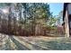 A spacious backyard features mature trees, sunlight and open space. Great for entertaining or enjoying the outdoors at 460 Chandler Bluff Ct, Grayson, GA 30017