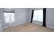Bedroom featuring gray walls, carpet floors and two windows for natural light at 460 Chandler Bluff Ct, Grayson, GA 30017