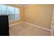 Bedroom with neutral paint, carpet floors, and natural light at 460 Chandler Bluff Ct, Grayson, GA 30017