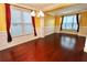 Dining room featuring hardwood floors, modern lighting, and large windows at 460 Chandler Bluff Ct, Grayson, GA 30017