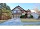 Beautiful two-story home featuring a well-maintained front yard and two car garage at 460 Chandler Bluff Ct, Grayson, GA 30017