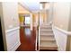 Inviting foyer featuring hardwood floors, stairway to second floor, and neutral walls at 460 Chandler Bluff Ct, Grayson, GA 30017