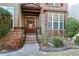 Charming entryway with a beautiful front door, sidelights and a brick facade at 460 Chandler Bluff Ct, Grayson, GA 30017