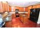 Kitchen with a central island, granite counters and stainless steel appliances at 460 Chandler Bluff Ct, Grayson, GA 30017