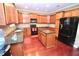 Well-equipped kitchen featuring granite countertops, stainless steel appliances, and a center island at 460 Chandler Bluff Ct, Grayson, GA 30017