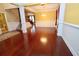 Spacious living room featuring hardwood floors, columns, and ample natural light at 460 Chandler Bluff Ct, Grayson, GA 30017