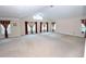 Bright living room featuring vaulted ceilings and multiple windows that provide natural light at 460 Chandler Bluff Ct, Grayson, GA 30017
