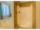 Tiled bathroom features a combination shower and tub at 477 Harvick Cir, Stockbridge, GA 30281