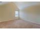 Bedroom with neutral carpet and an attic window at 477 Harvick Cir, Stockbridge, GA 30281