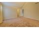 Large carpeted bedroom with multiple entry doors at 477 Harvick Cir, Stockbridge, GA 30281
