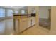 A view into the kitchen area featuring a dishwasher and a black tile backsplash at 477 Harvick Cir, Stockbridge, GA 30281
