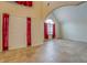 Inviting living room features high ceilings, an arched window, and neutral tile flooring at 477 Harvick Cir, Stockbridge, GA 30281