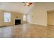 Vaulted living area featuring a fireplace, two large windows, and neutral tile flooring at 477 Harvick Cir, Stockbridge, GA 30281
