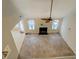 A open living room featuring an a ceiling fan and fireplace at 477 Harvick Cir, Stockbridge, GA 30281