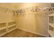 Walk-in closet with shelving and carpet flooring at 477 Harvick Cir, Stockbridge, GA 30281