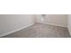 A carpeted bedroom with neutral walls and white trim features a window at 100 Hunters Keep Trce, Covington, GA 30014
