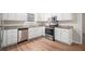 Updated kitchen with stainless steel appliances, granite countertops, and ample cabinet space for storage at 100 Hunters Keep Trce, Covington, GA 30014