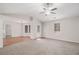 Bright living room featuring plush carpeting, hardwood floors, and plenty of natural light, inviting space at 100 Hunters Keep Trce, Covington, GA 30014