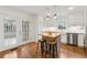 Stylish kitchen with white cabinetry, stainless steel appliances, and island seating at 3084 Brookshire Way Way, Duluth, GA 30096