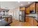 Kitchen with stainless appliances, granite countertops, and a view to the breakfast area at 6980 Polo Fields Pkwy, Cumming, GA 30040