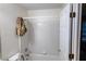 Clean white tiled tub and shower combo in bathroom at 1159 Bowerie Chase, Powder Springs, GA 30127