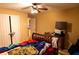 A bedroom featuring a ceiling fan, a wooden bed frame, and neutral-toned walls at 1159 Bowerie Chase, Powder Springs, GA 30127