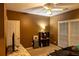 Cozy bedroom with a ceiling fan, natural light from windows, and space for a comfortable bed at 1159 Bowerie Chase, Powder Springs, GA 30127