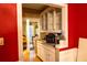 Butlers pantry with white cabinetry, counter space and an open doorway to an adjacent room at 1159 Bowerie Chase, Powder Springs, GA 30127