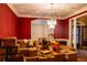 Dining room painted in red currently used for storage and staging during the moving process at 1159 Bowerie Chase, Powder Springs, GA 30127