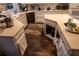 Kitchen with a center island, white cabinets, and ample counter space, offering functionality and storage at 1159 Bowerie Chase, Powder Springs, GA 30127