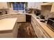 Functional kitchen featuring white cabinetry, ample counter space, and a corner sink setup at 1159 Bowerie Chase, Powder Springs, GA 30127