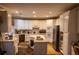 Well-lit kitchen with white cabinets, an island, and modern appliances, offering a functional layout at 1159 Bowerie Chase, Powder Springs, GA 30127