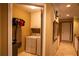 Convenient laundry room adjacent to the hallway at 1159 Bowerie Chase, Powder Springs, GA 30127