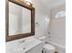 Bathroom with a framed mirror, white vanity, and combined shower and tub at 1900 Sanborne Way, Dacula, GA 30019