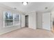 Bedroom featuring a closet, window, neutral carpet, and white trim at 1900 Sanborne Way, Dacula, GA 30019