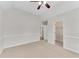 Bedroom featuring a ceiling fan, neutral carpet, large closet, and white trim at 1900 Sanborne Way, Dacula, GA 30019