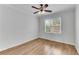 Neutral bedroom with hardwood floors and a large window providing natural light at 1900 Sanborne Way, Dacula, GA 30019