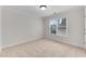 Bedroom with neutral carpet, window for natural light, and white trim at 1900 Sanborne Way, Dacula, GA 30019